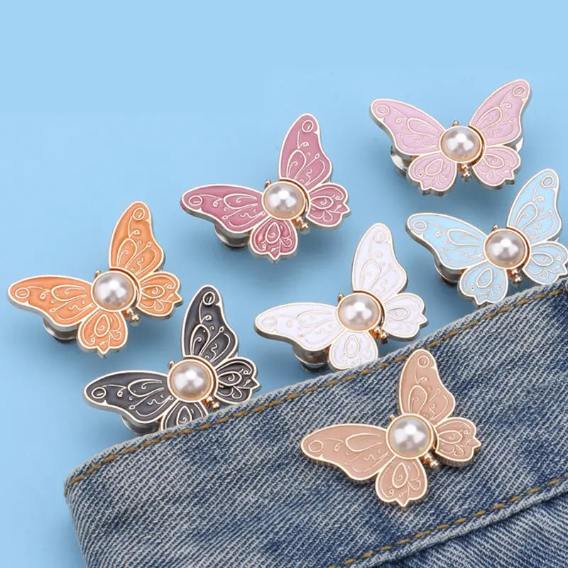 Calças de botões com detalhe de borboleta de pérola na cintura, cintura fixa.