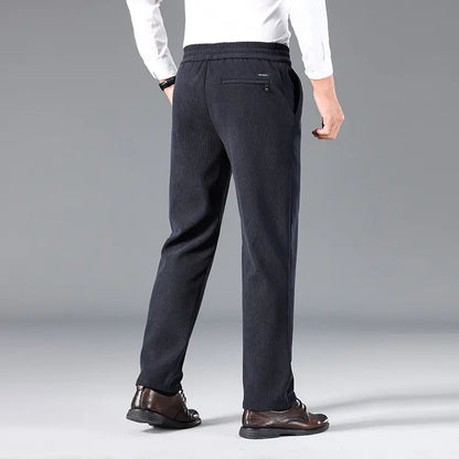 👖【Tamanhos L-5XL】Calça de moletom de veludo plus size para homem, ideal para o outono e inverno. Calça casual larga.